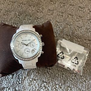 White Michael Kora watch.